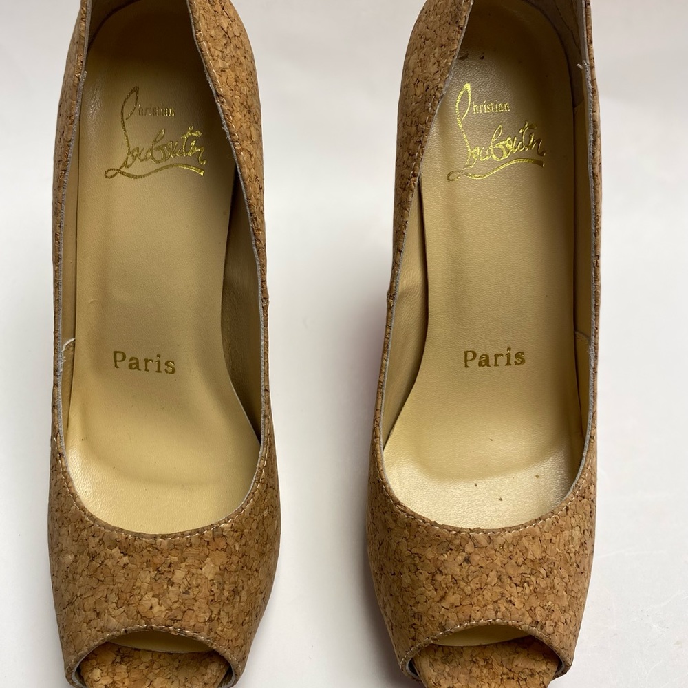 elegant and original high heel shoes, light tan color with open toes.